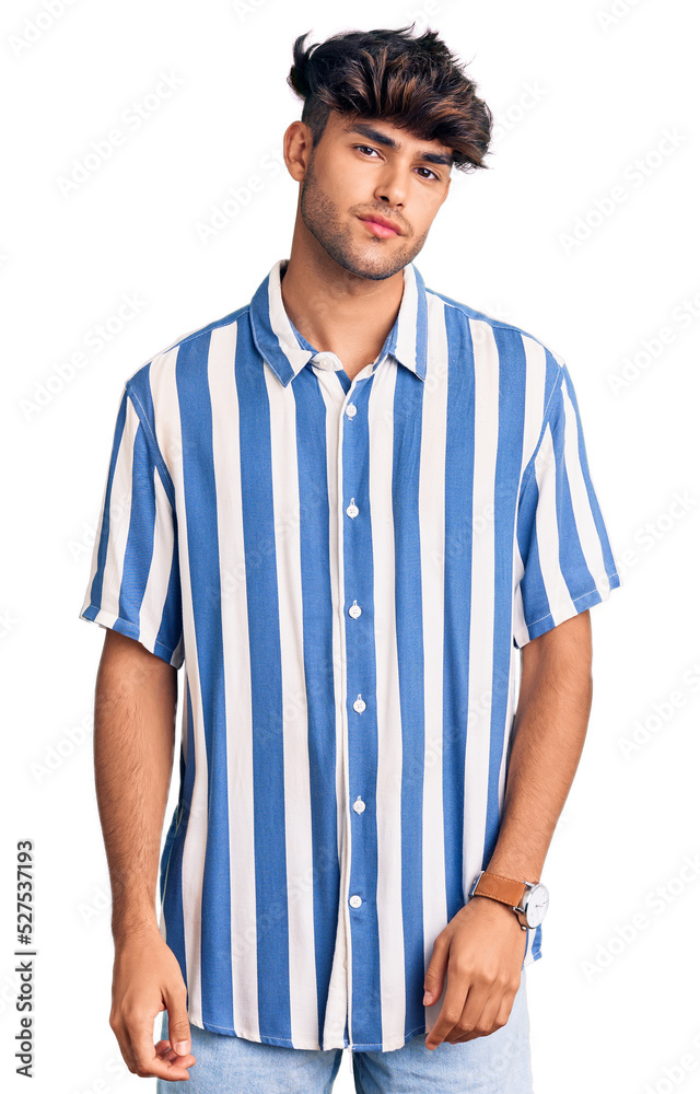 Young hispanic man wearing casual clothes looking sleepy and tired, exhausted for fatigue and hangover, lazy eyes in the morning. Young hispanic man wearing casual clothes looking sleepy and tired, exhausted for fatigue and hangover, lazy eyes in the morning.
