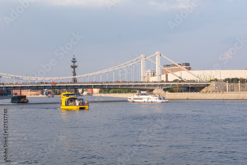 MOSCOW, RUSSIA - August 25, 2022 : View of the Moskva River with a cruise boat in Moscow, Russia
