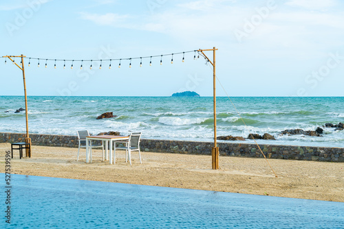 dinning table and chair on beach with sea background