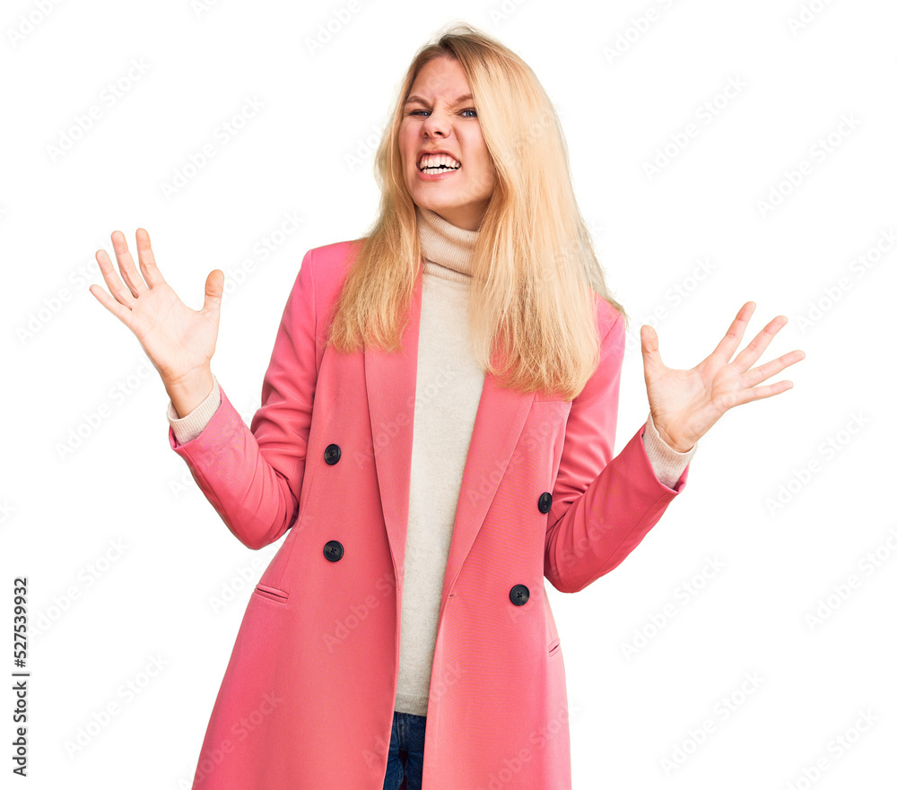 Young beautiful blonde woman wearing elegant clothes crazy and mad shouting and yelling with aggressive expression and arms raised. frustration concept. Young beautiful blonde woman wearing elegant clothes crazy and mad shouting and yelling with aggressive expression and arms raised. frustration concept.