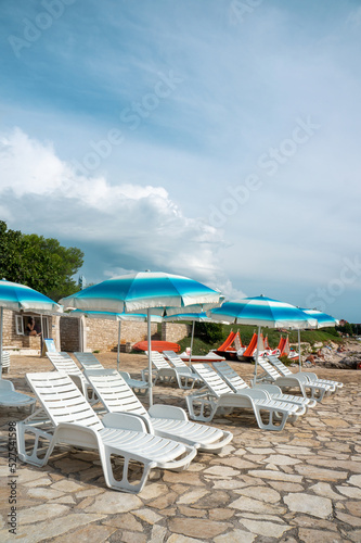 Sun loungers on the beach in Europe. Sunny beaches of Croatia © oksanamedvedeva