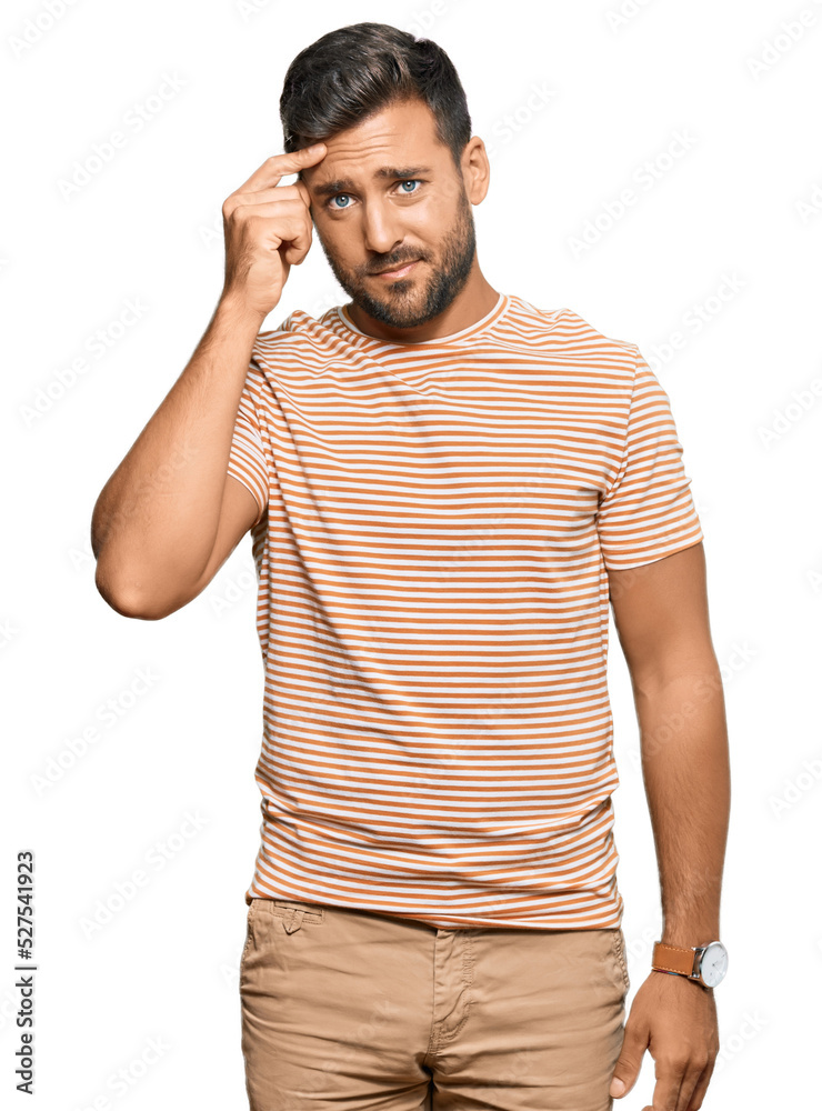 Handsome hispanic man wearing casual clothes pointing unhappy to pimple on forehead, ugly infection of blackhead. acne and skin problem Handsome hispanic man wearing casual clothes pointing unhappy to pimple on forehead, ugly infection of blackhead. acne and skin problem