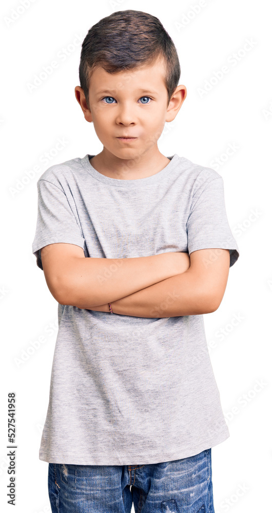 Cute blond kid wearing casual clothes skeptic and nervous, disapproving expression on face with crossed arms. negative person. Cute blond kid wearing casual clothes skeptic and nervous, disapproving expression on face with crossed arms. negative person.