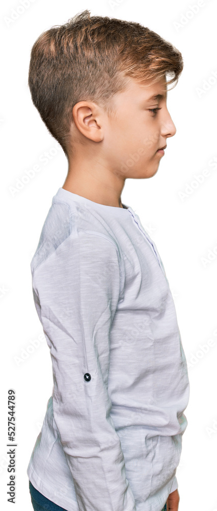 Little caucasian boy kid wearing casual clothes looking to side, relax profile pose with natural face with confident smile. Little caucasian boy kid wearing casual clothes looking to side, relax profile pose with natural face with confident smile.
