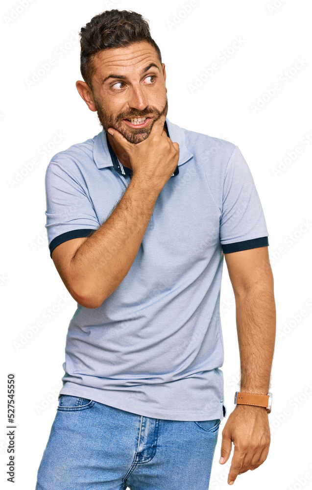 Handsome man with beard wearing casual clothes thinking worried about a question, concerned and nervous with hand on chin Handsome man with beard wearing casual clothes thinking worried about a question, concerned and nervous with hand on chin