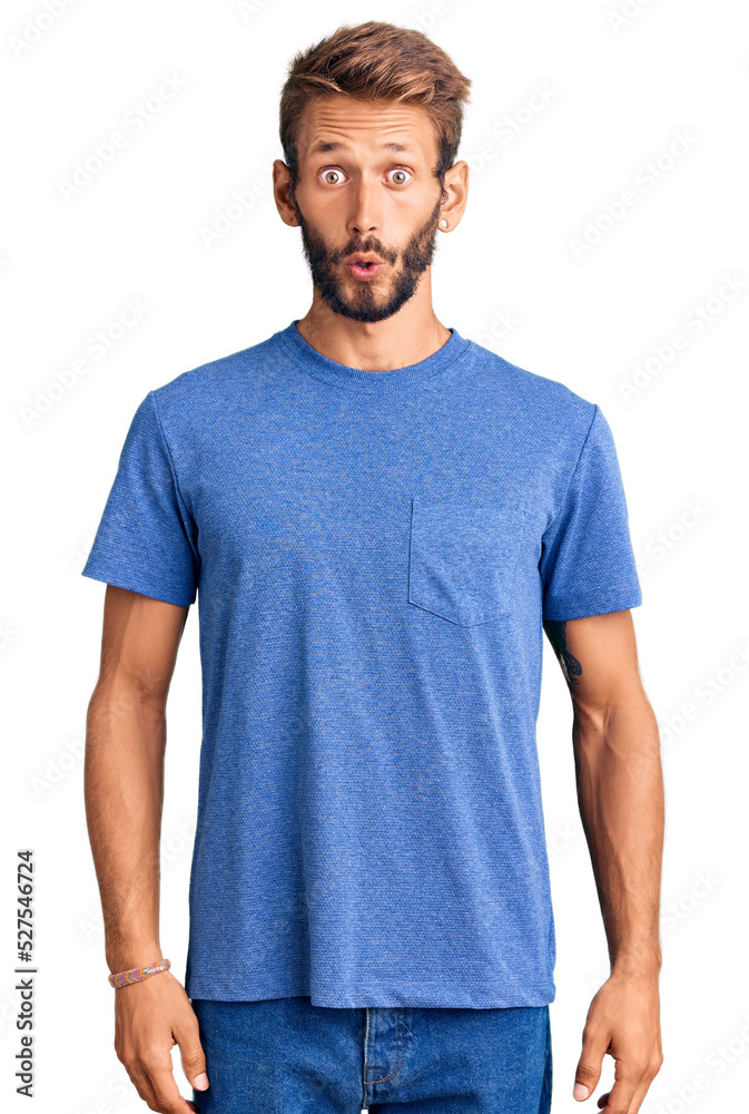 Handsome blond man with beard wearing casual clothes scared and amazed with open mouth for surprise, disbelief face Handsome blond man with beard wearing casual clothes scared and amazed with open mouth for surprise, disbelief face