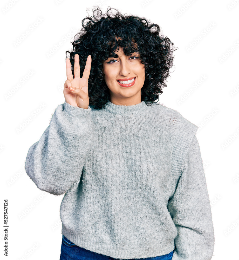 Young middle east girl wearing casual clothes showing and pointing up with fingers number three while smiling confident and happy. Young middle east girl wearing casual clothes showing and pointing up with fingers number three while smiling confident and happy.
