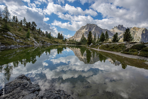 Reflections on Lake Limedes in the Dolomites near Falzarego pass, Italy. © faber121