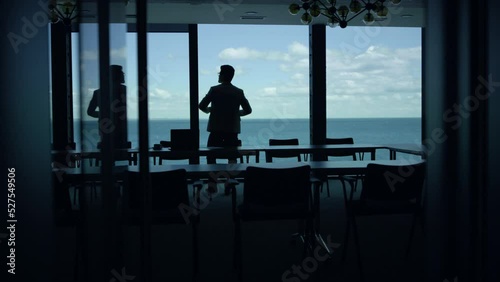 Wallpaper Mural Businessman silhouette watching sea view big window. Entrepreneur taking break Torontodigital.ca