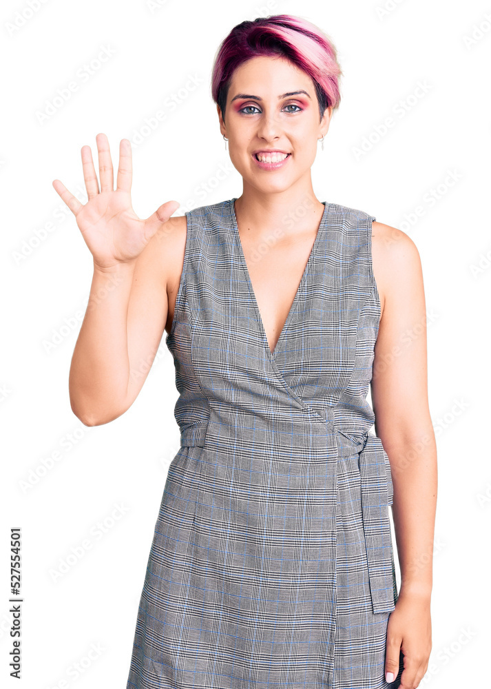 Young beautiful woman with pink hair wearing casual clothes showing and pointing up with fingers number five while smiling confident and happy. Young beautiful woman with pink hair wearing casual clothes showing and pointing up with fingers number five while smiling confident and happy.