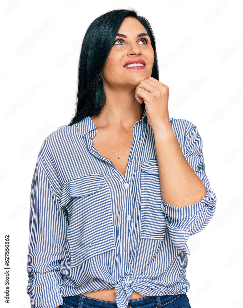 Young caucasian woman wearing casual clothes with hand on chin thinking about question, pensive expression. smiling and thoughtful face. doubt concept. Young caucasian woman wearing casual clothes with hand on chin thinking about question, pensive expression. smiling and thoughtful face. doubt concept.