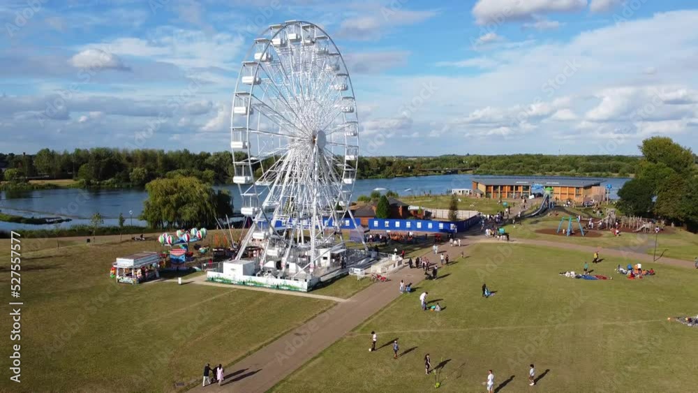 Ferris Wheel and Rides at Willen Lake Public Park Milton Keynes, England UK. Willen Lake is a