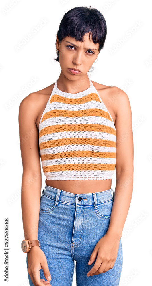 Fototapeta premium Young brunette woman with short hair wearing casual clothes depressed and worry for distress, crying angry and afraid. sad expression.