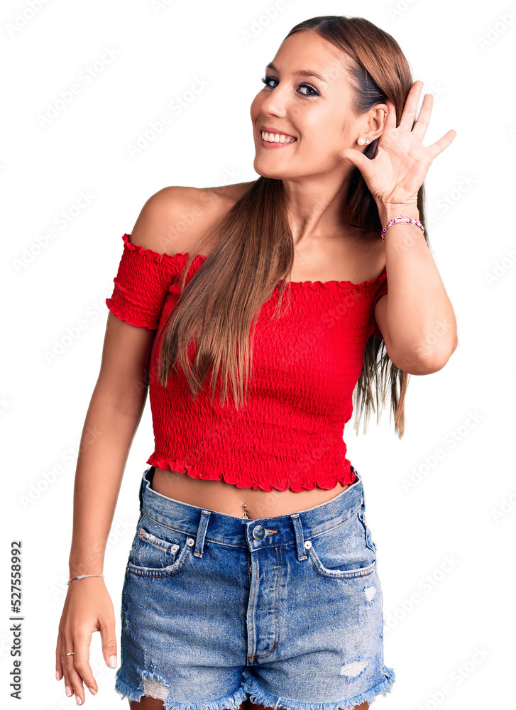 Young beautiful hispanic woman wearing casual clothes smiling with hand over ear listening an hearing to rumor or gossip. deafness concept. Young beautiful hispanic woman wearing casual clothes smiling with hand over ear listening an hearing to rumor or gossip. deafness concept.