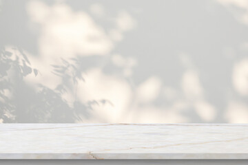 Marble table with tree shadow drop on white wall background for mockup product display