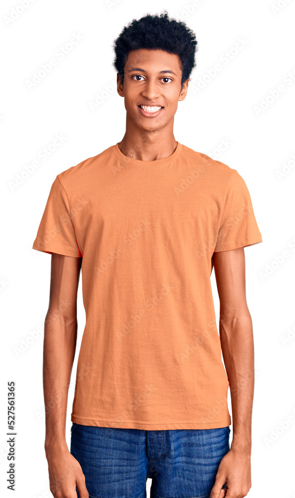 Fototapeta premium Young african american man wearing casual clothes with a happy and cool smile on face. lucky person.