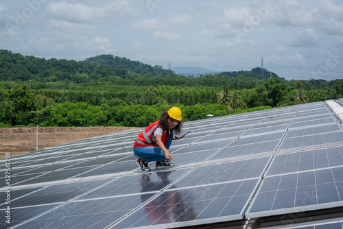 Wallpaper Mural Solar power,Engineer inspect solar panels on the roof of a factory where solar panels are installed using solar energy. Torontodigital.ca