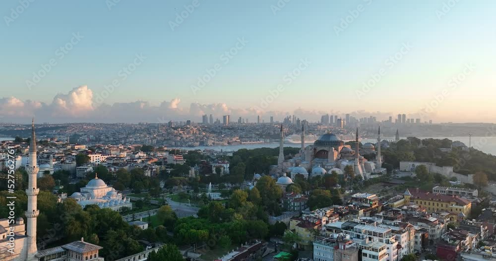 Istanbul, Turkey. Sultanahmet with the Blue Mosque and the Hagia Sophia with a Golden Horn on the background at sunrise. Cinematic Aerial view. Istanbul, Turkey. Sultanahmet with the Blue Mosque and the Hagia Sophia with a Golden Horn on the background at sunrise. Cinematic Aerial view.