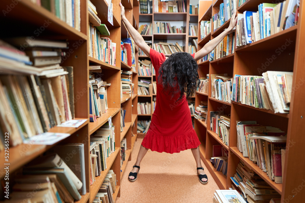 Back to school with attractive librarian in red dress