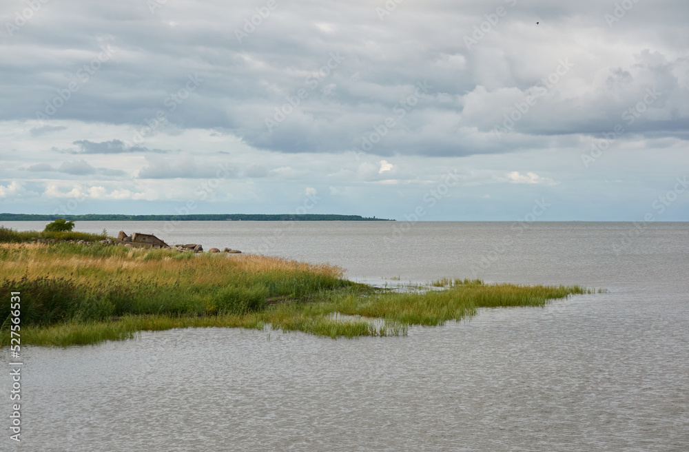 Panoramic view from the rocky sea shore. Dramatic sky. clouds. Kuivastu harbour, Estonia. Nature, eco tourism, wanderlust, summer vacation concepts