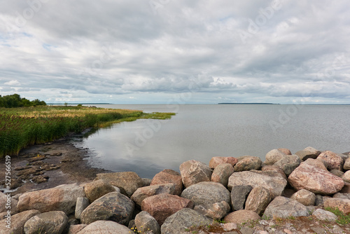 Panoramic view from the rocky sea shore. Dramatic sky. clouds. Kuivastu harbour, Estonia. Nature, eco tourism, wanderlust, summer vacation concepts photo