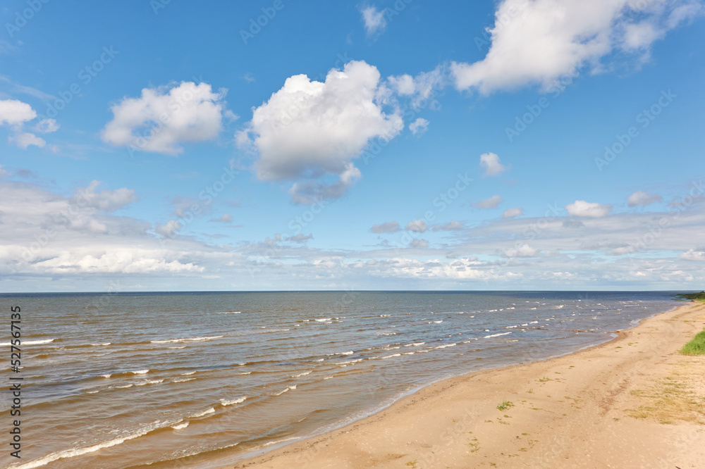 Panoramic view of the Baltic sea from a sandy shore on a sunny summer day. Clouds. Kabli beach, Estonia. Nature, eco tourism, wanderlust, vacation concepts