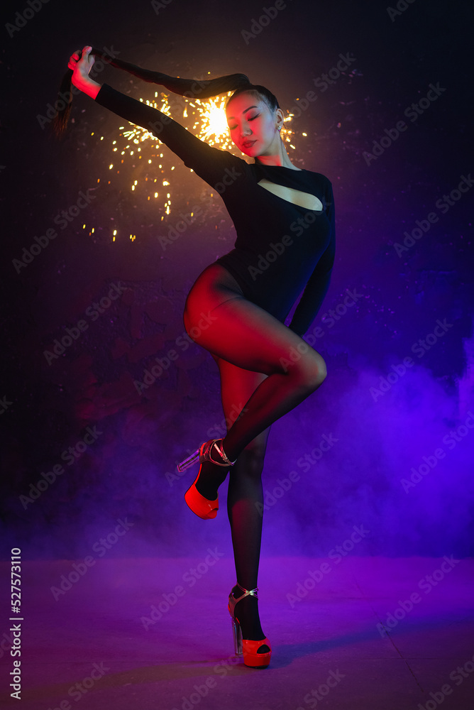Beautiful girl dancer in the neon lights concept.