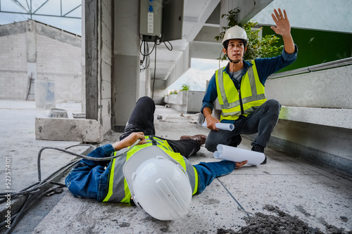 Schilderij op canvas Accident at work, an Asian engineer or electrician is electrocuted to the ground