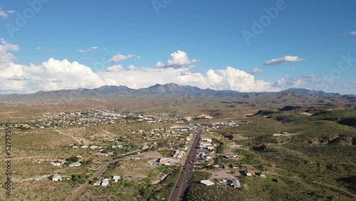 4K Drone flyover highway in Kingman Arizona, light traffic with mountains in the background, large clouds behind the Hualapai mountains photo