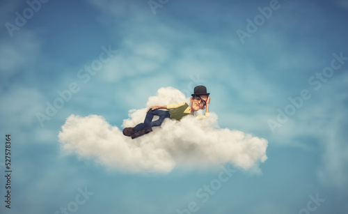 Man floating air while sleeping on a cloud.