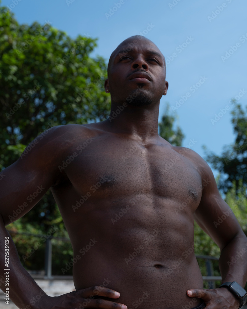 Portrait of shirtless athletic man outdoors