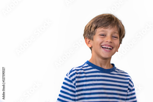 Little elementary age boy smiling.Child on a white background. Image with copy space