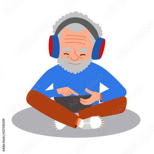 The old man is sitting in the lotus position listening to music with headphones and playing on a tablet. The concept of vector illustration in a flat cartoon style.