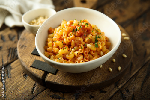 Pasta with tomato sauce and pine nuts