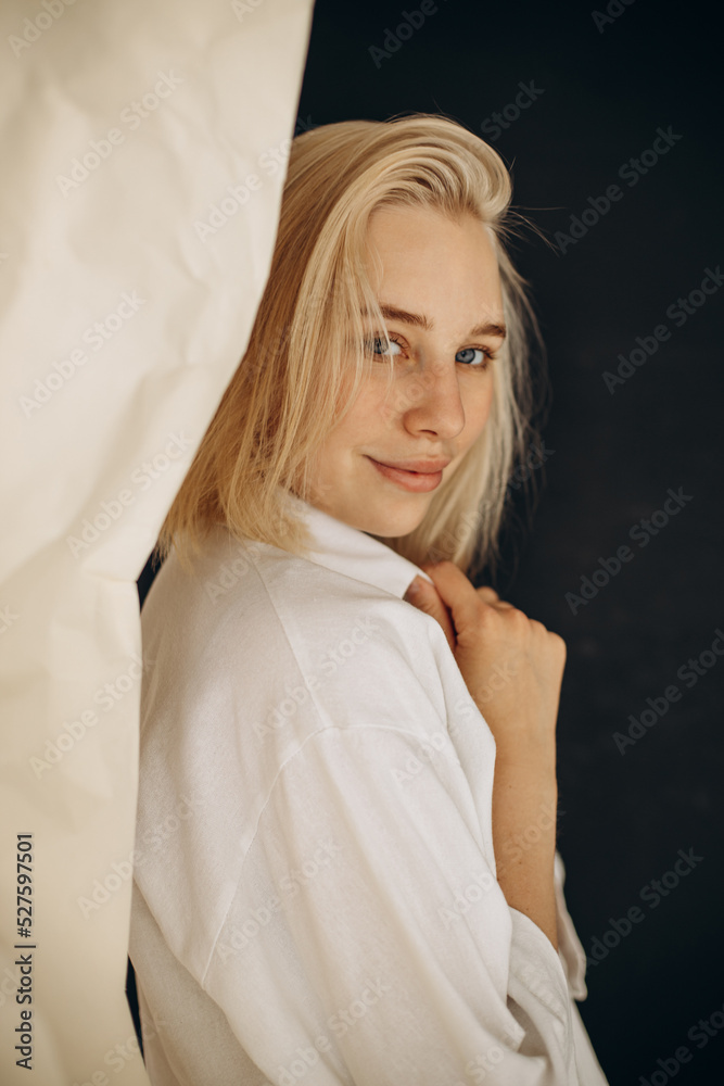 Fototapeta premium Young beautiful woman posing in studio