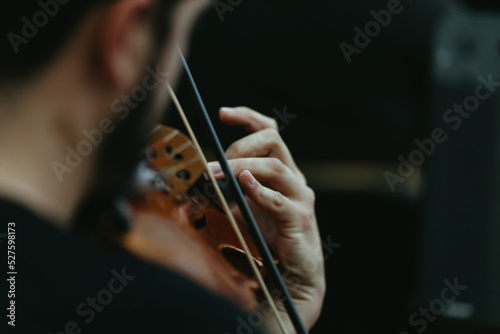 Close up musician playing violin