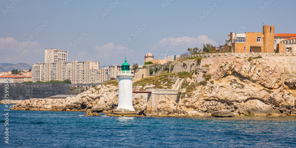 La Désirade, a rocky point and a maritime traffic green light at the entrance to the Old Port of Marseille