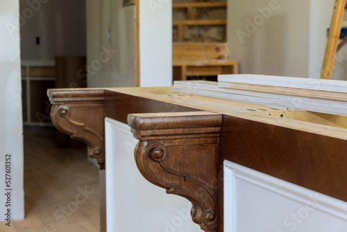In a new kitchen, corbels were installed on the island to provide support for granite countertops on the island. photo