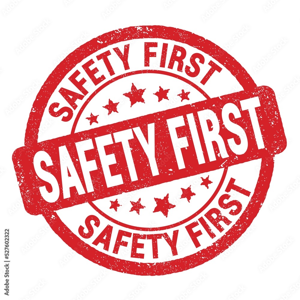 SAFETY FIRST text written on red round stamp sign. SAFETY FIRST text written on red round stamp sign.