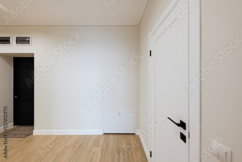 Interior design of a bright corridor with stylish furniture. Cleanliness and order