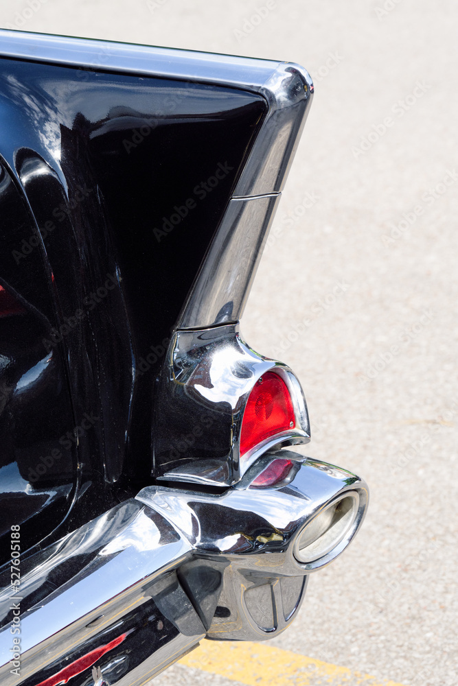 Fototapeta premium red tail light on vintage black and silver car