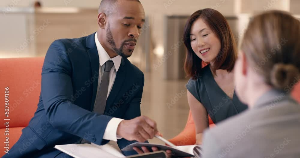 Business, paperwork and man in a meeting with customers in modern hotel lobby sitting on sofa. Consultant, law and black attorney reading documents to professional company clients at corporate firm.