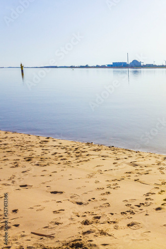 Atomic nuclear power station wadden sea tidelands coast landscape Germany. photo