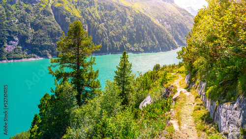 Vivid blue mountain lake in summer Alps photo