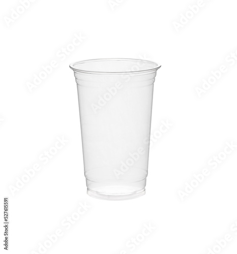 Disposable clear plastic cup standing in isolated environment