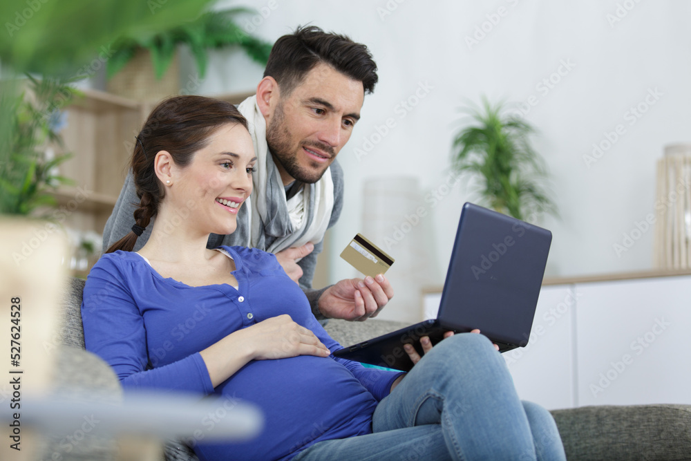 couple buying online on the interent with a credit card