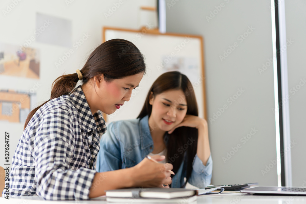 Construction business plan concept, Two architects discuss about project and blueprint of building Construction business plan concept, Two architects discuss about project and blueprint of building