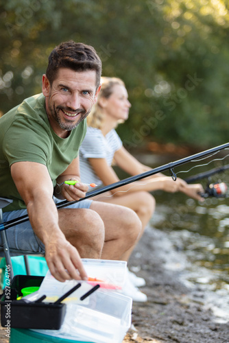 couple is enjoying fishing on sunny day