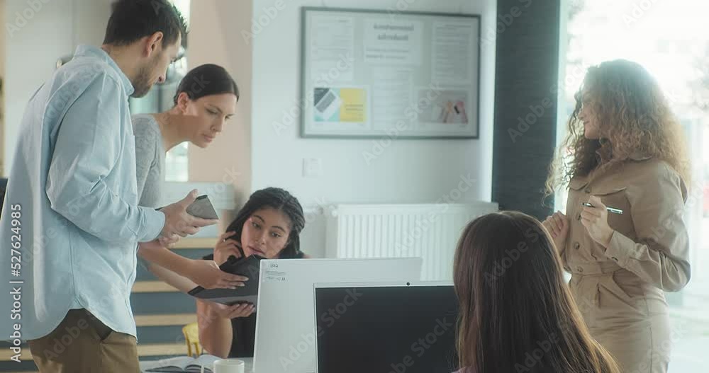 People working together in office, Discussing of young business people. Mixed race creative team meeting in modern work space. We are stronger together. 4K slow motion.