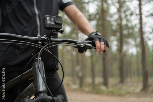 An action camera for photos and videos is installed on an extreme sports bike